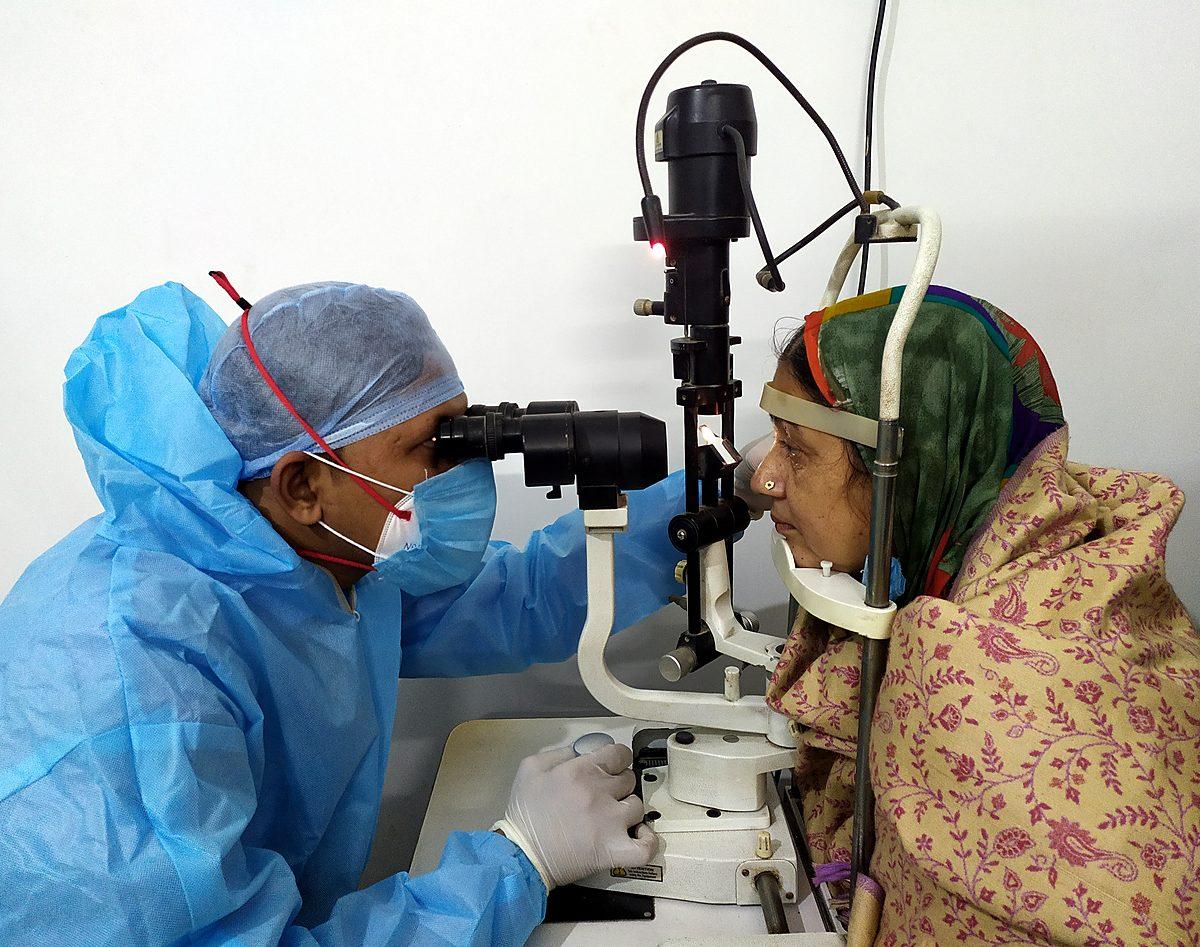 Slit-lamp eye examination at a Wellity Care community health camp